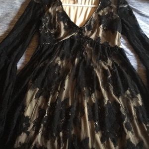 Cute Black and Tan dress with lacy sleeves.
